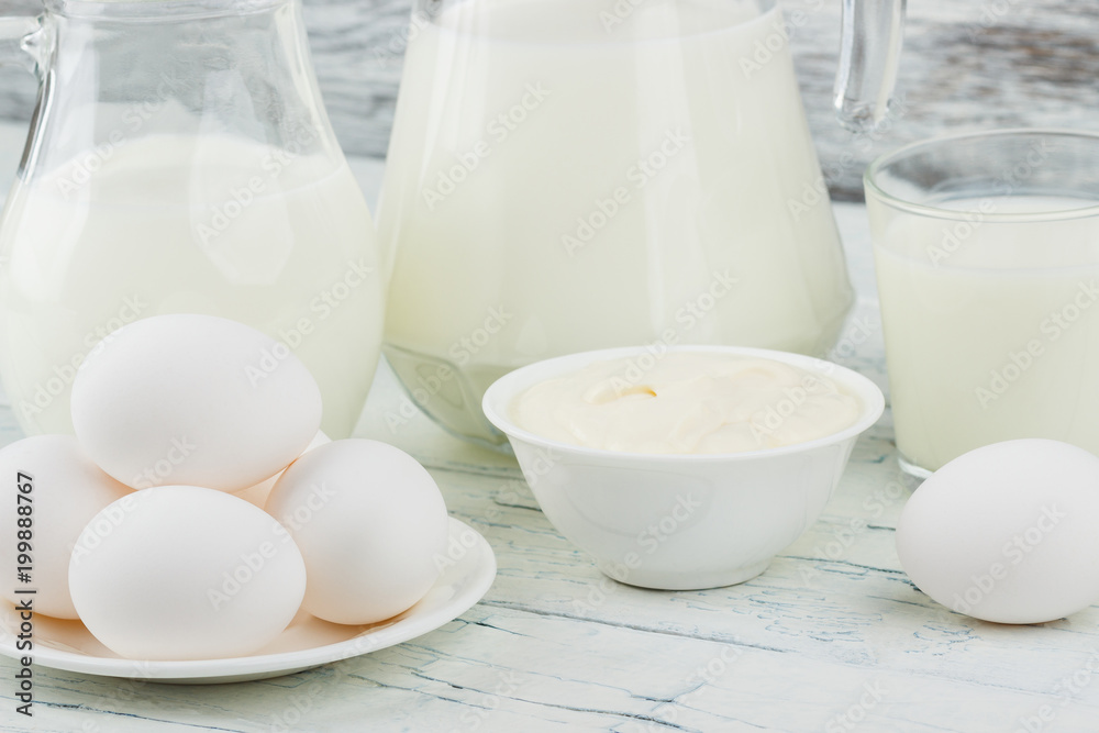 Different dairy products on the wooden background