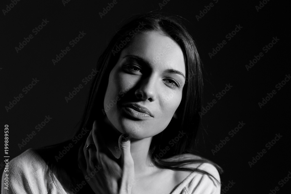 Black and white portrait of beautiful woman with natural look and without makeup.