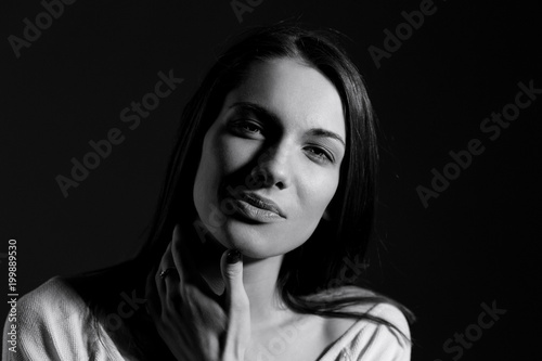 Black and white portrait of beautiful woman with natural look and without makeup.