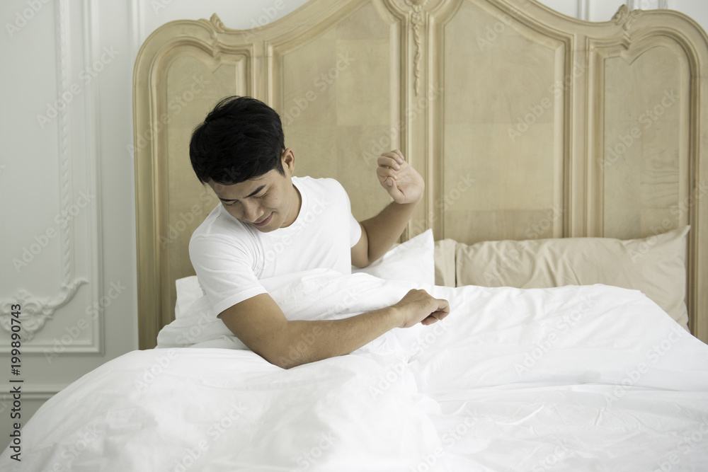 Young man is waking up in the morning. Young man is waking up in the morning.