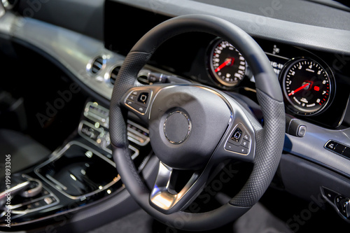 Clean console modern car interior black steering wheel