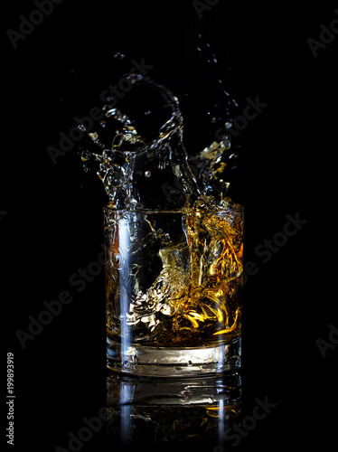 Splash in glass of whiskey