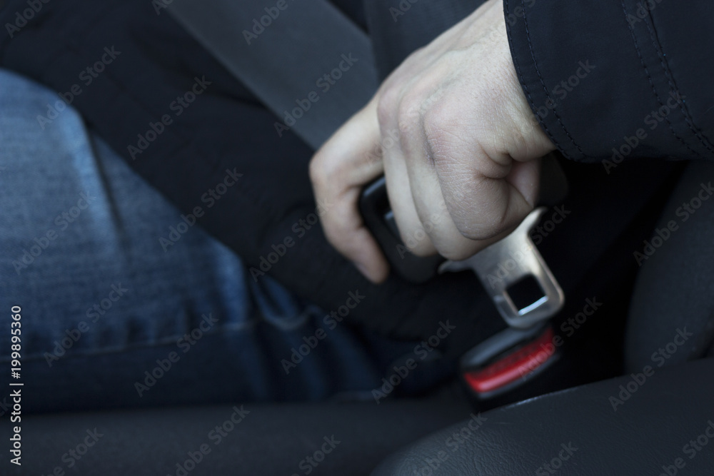 Man's Hand holds the safety belt