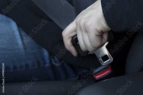 Man's Hand holds the safety belt