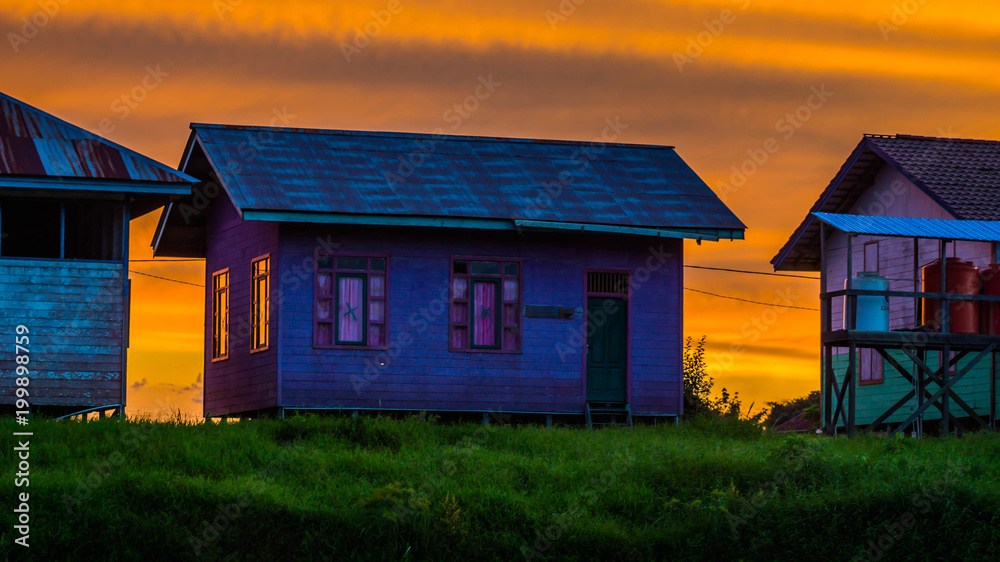 rural / countryside wooden house at dawn with vibrant color