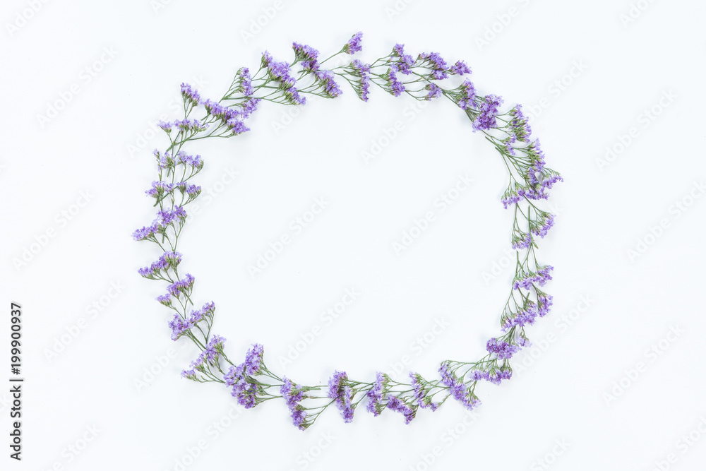 Flower wreath frame made of different flowers and leaves, flat lay, top view. Holiday background Flower wreath frame made of different flowers and leaves, flat lay, top view. Holiday background