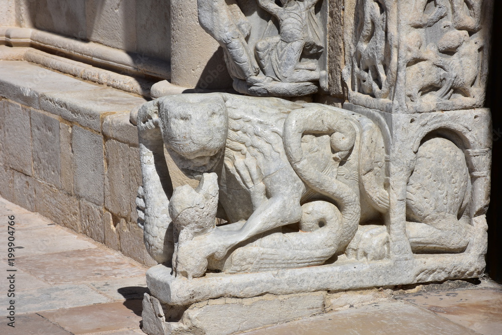 Italy, Puglia, Cathedral of Trani, a messenger monument of a UNESCO culture of peace, is a splendid example of Apulian Romanesque architecture. Details of the main facade. Italy, Puglia, Cathedral of Trani, a messenger monument of a UNESCO culture of peace, is a splendid example of Apulian Romanesque architecture. Details of the main facade.