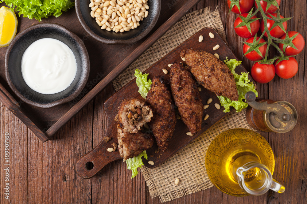 Traditional arabic kibbeh with lamb and pine nuts.