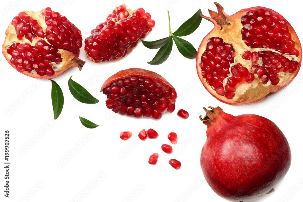 pomegranate fruit with green leaves isolated on a white background top view pomegranate fruit with green leaves isolated on a white background top view
