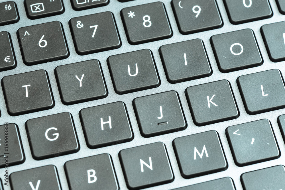 Closeup of laptop keyboard buttons with symbols Closeup of laptop keyboard buttons with symbols