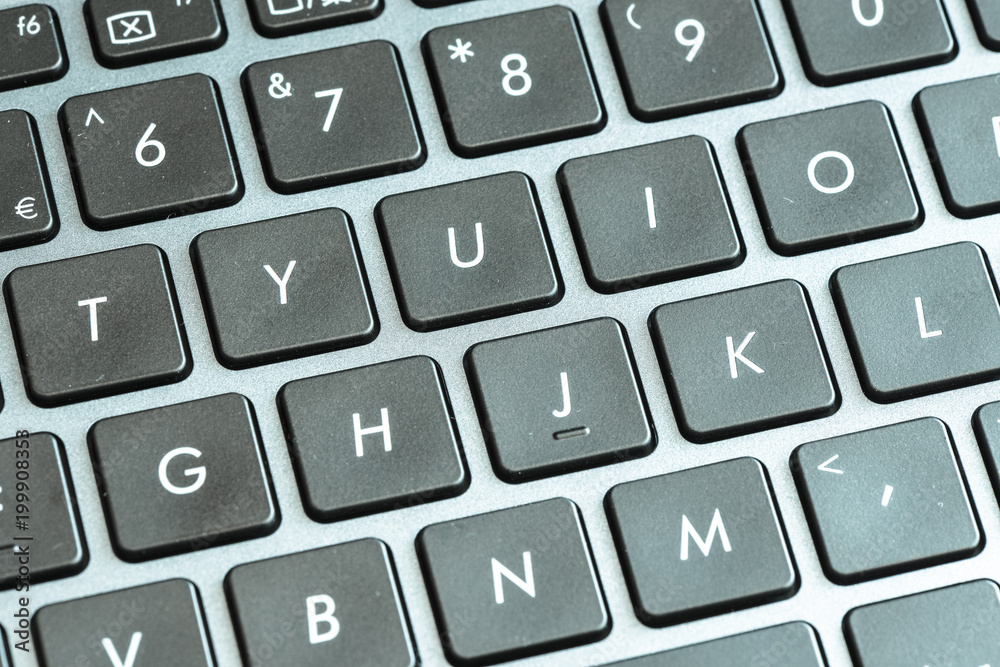 Closeup of laptop keyboard buttons with symbols 