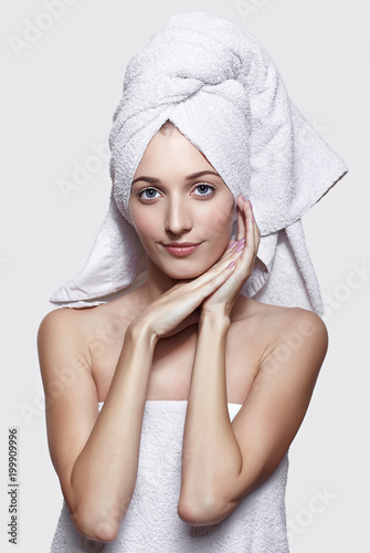 Young woman with bath towel on the head