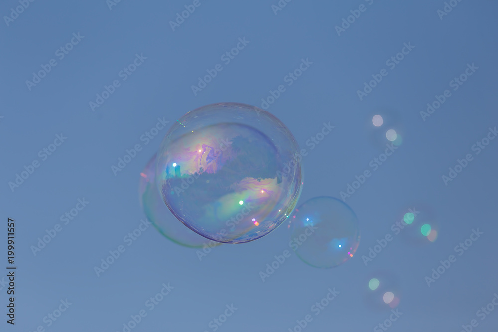 Nice bubbles flying on the blue sky Nice bubbles flying on the blue sky