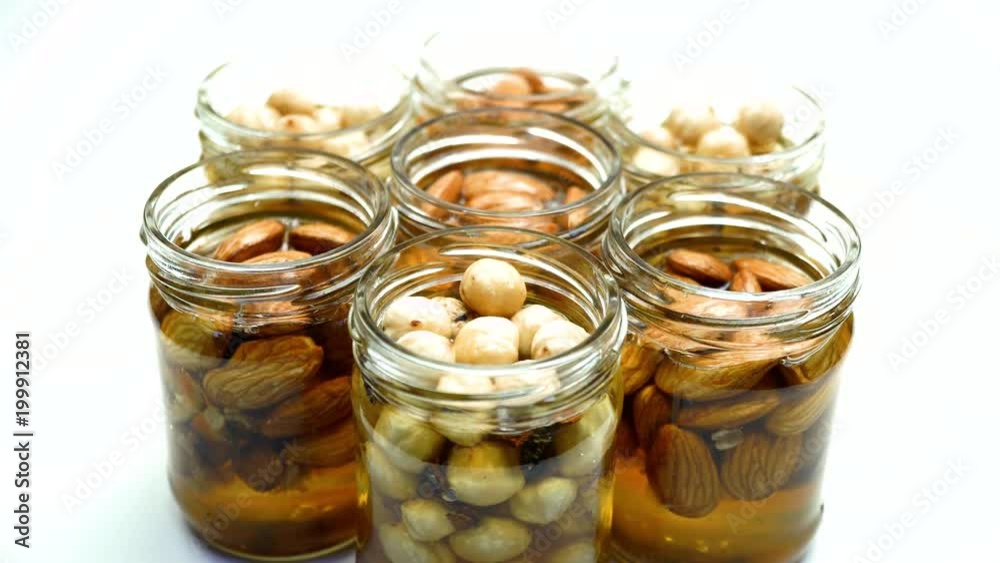 Mix the chickpeas with honey in the glass jar. On the rotating table. Mix the chickpeas with honey in the glass jar. On the rotating table.