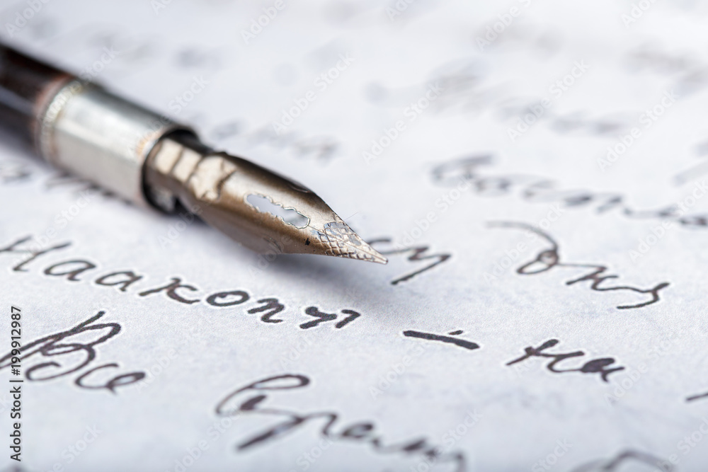 Fountain pen on an antique handwritten letter Fountain pen on an antique handwritten letter
