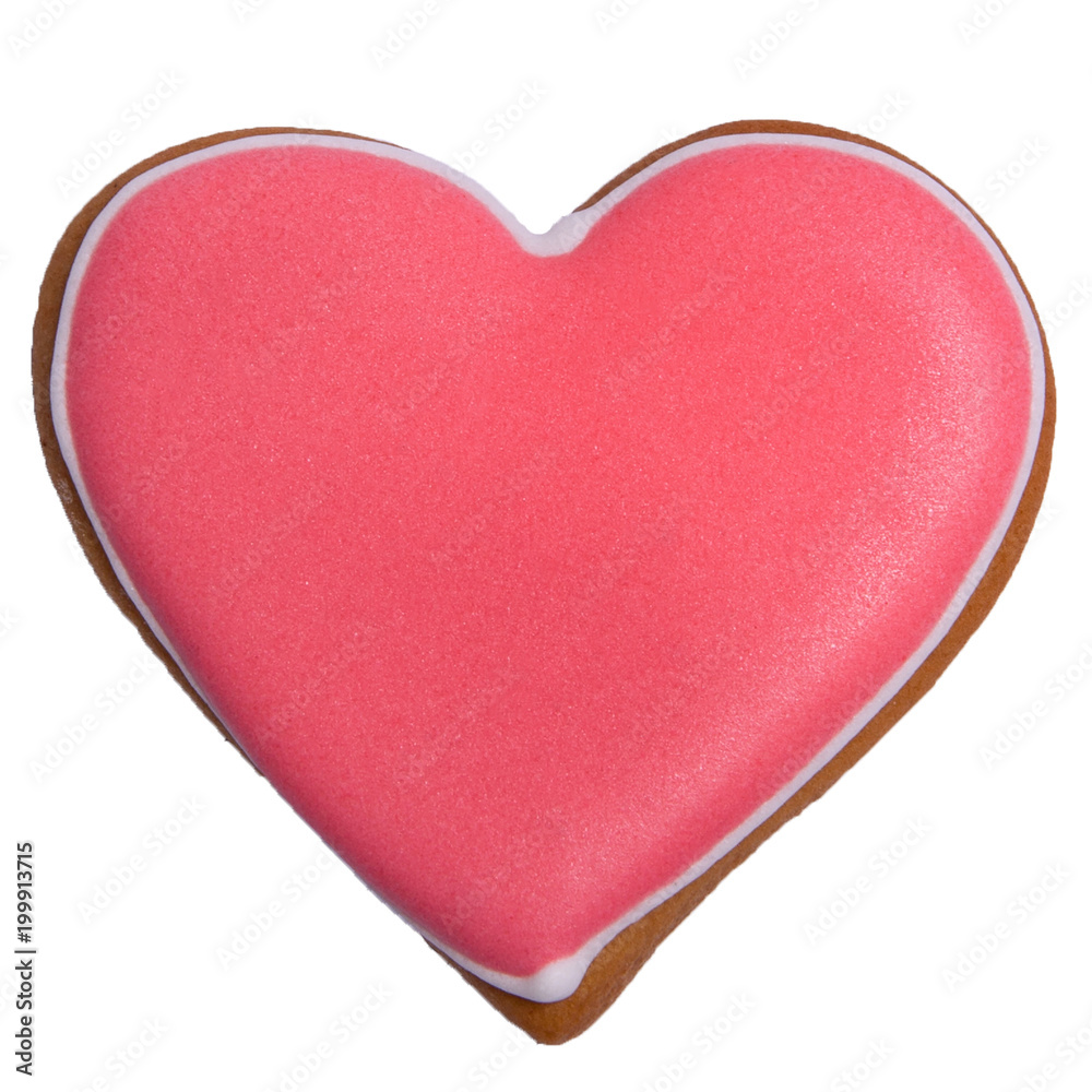 Red gingerbread as heart with colored glaze on isolated closeup