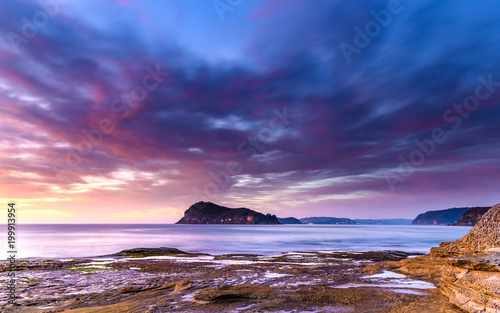Dawn Seascape with Island and Soft Clouds