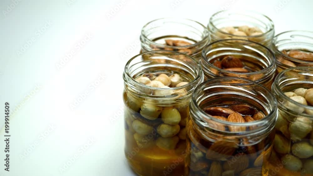 Mix the chickpeas with honey in the glass jar. On the rotating table. Mix the chickpeas with honey in the glass jar. On the rotating table.