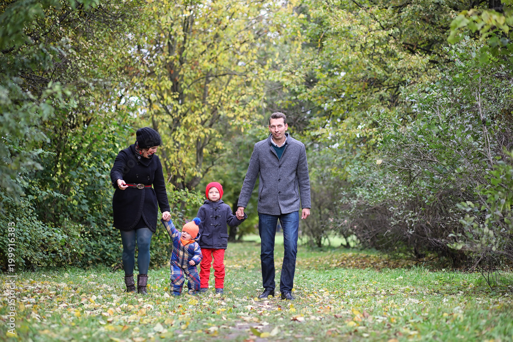 Young family with children on a walk Young family with children on a walk