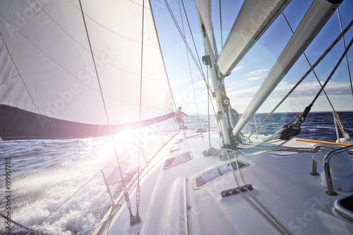 Fototapeta Sailing into the sun in Croatia