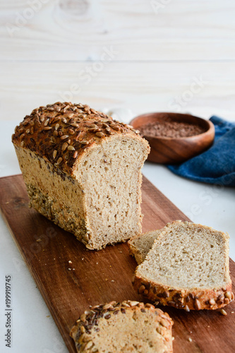 Slices of finest organic bread decorated with natural cereals.