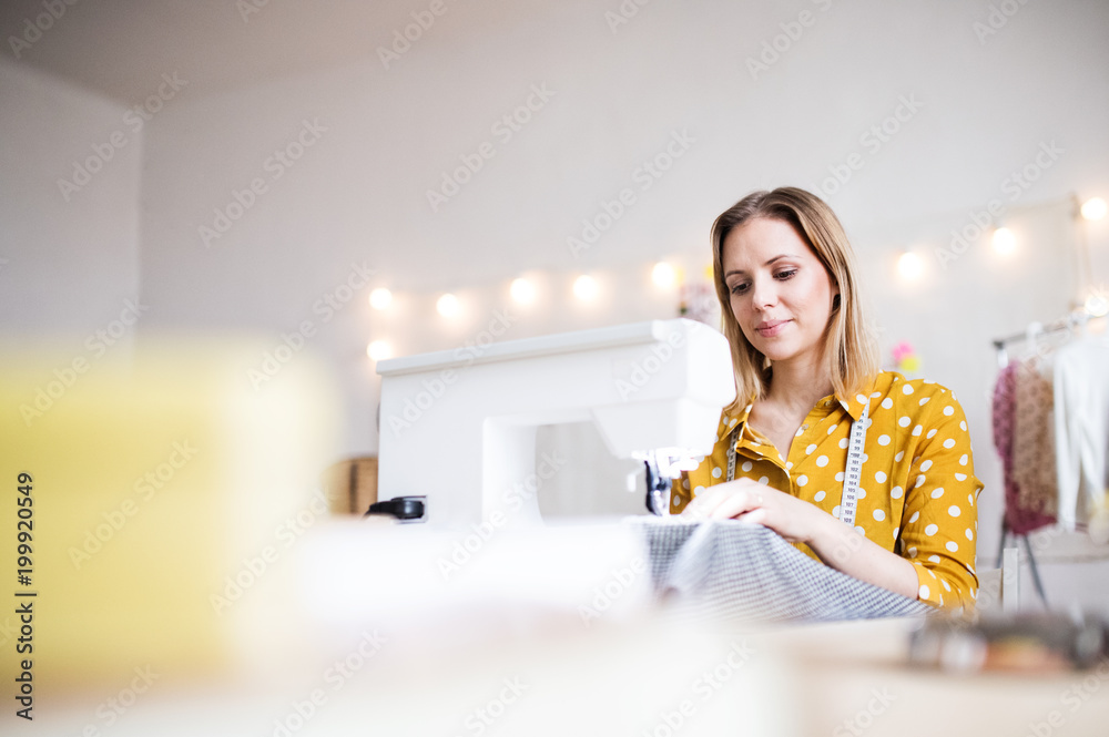 Young creative woman in a studio, startup business. Young creative woman in a studio, startup business.