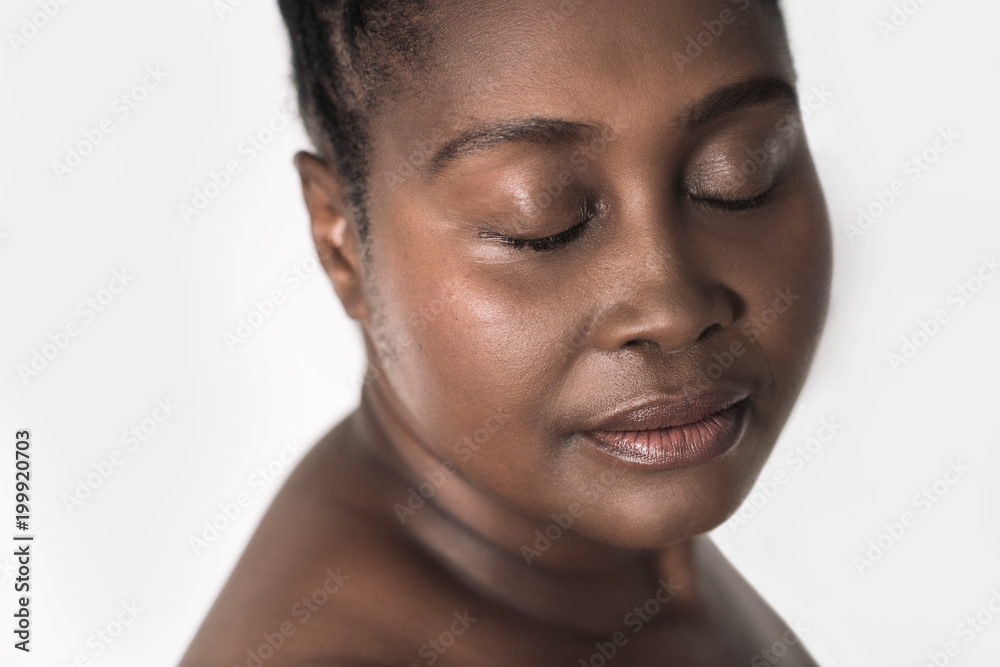 Beautiful young African woman with her eyes closed Beautiful young African woman with her eyes closed