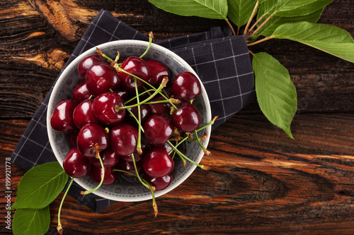 Delicious cherries in bowl from above.