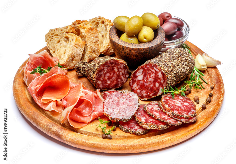Dried organic salami sausage or spanish chorizo on wooden cutting board Dried organic salami sausage or spanish chorizo on wooden cutting board