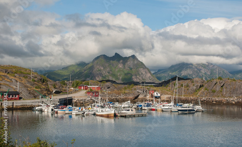 Boats and yachts in a bay on a background of mountains, Lofoten, Norway