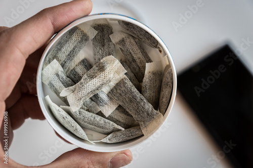 фотографія Snus -  Snus, a moist powder tobacco product widely consumed in Norway and Swede