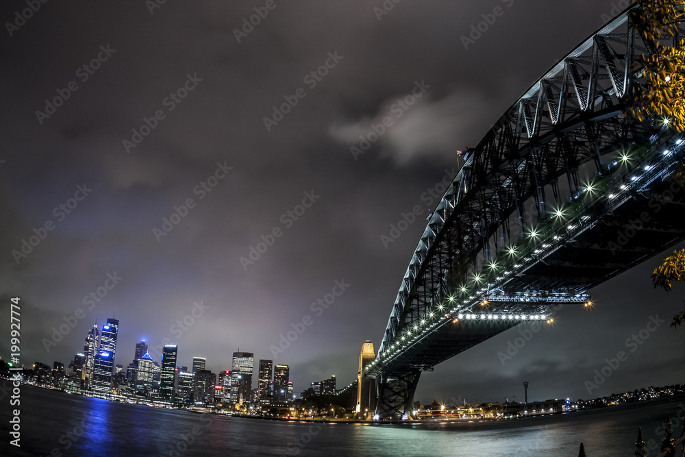 Obraz premium Fisheye image of Sydney Harbor Bridge at night, Australia.