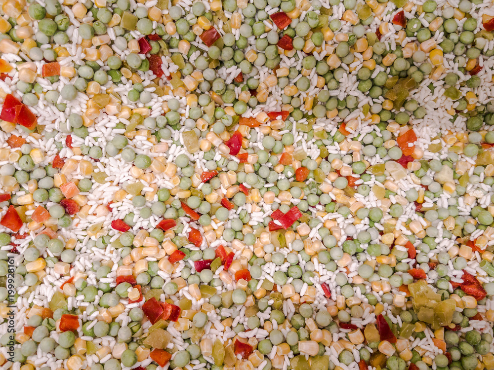 Mix of colorful tasty frosty vegetables. Mexican, Hawaiian mix. Corn, carrots, tomatoes, onion, green beans. Frozen vegetables concept Mix of colorful tasty frosty vegetables. Mexican, Hawaiian mix. Corn, carrots, tomatoes, onion, green beans. Frozen vegetables concept