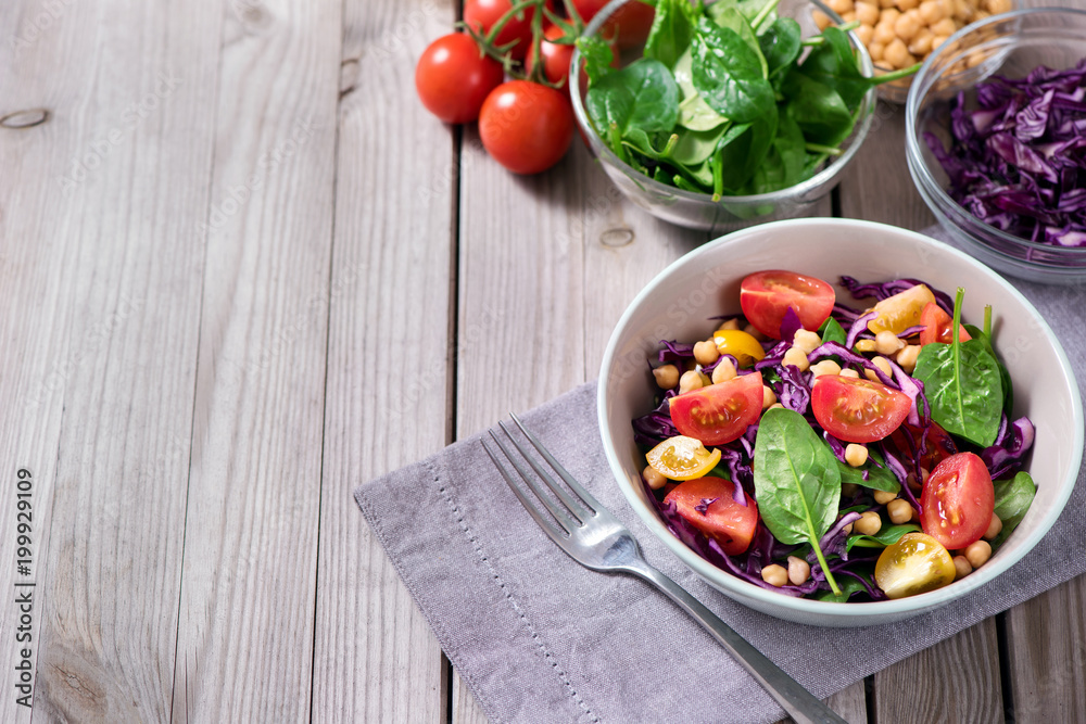Chickpeas salad with spinach and red cabbage, healthy food, vegetarian and vegan snack, clean eating, diet, detox, copy space Chickpeas salad with spinach and red cabbage, healthy food, vegetarian and vegan snack, clean eating, diet, detox, copy space