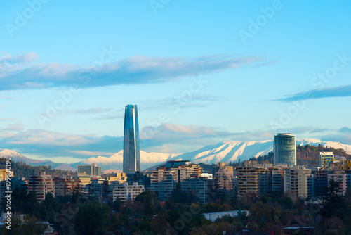 Skyline of residential buildings at Las Condes district with snowed hills in the back, Santiago de Chile photo
