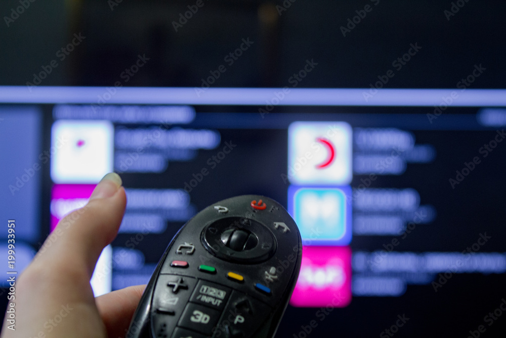 Watching TV and using remote controller Watching TV and using remote controller