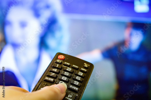 Watching TV and using remote controller