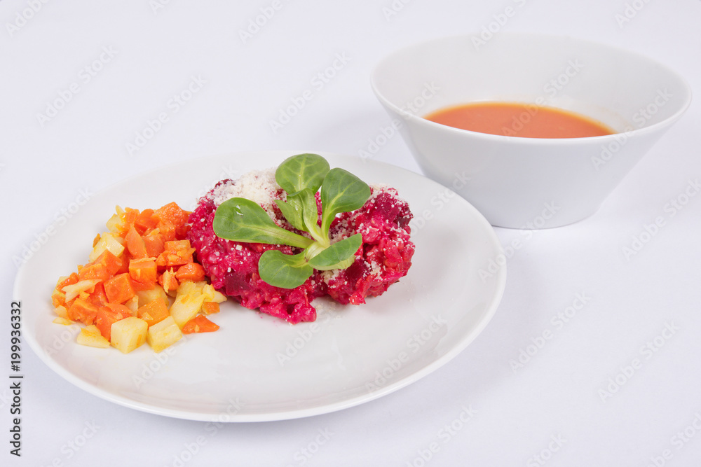 Risotto with red beet on a white