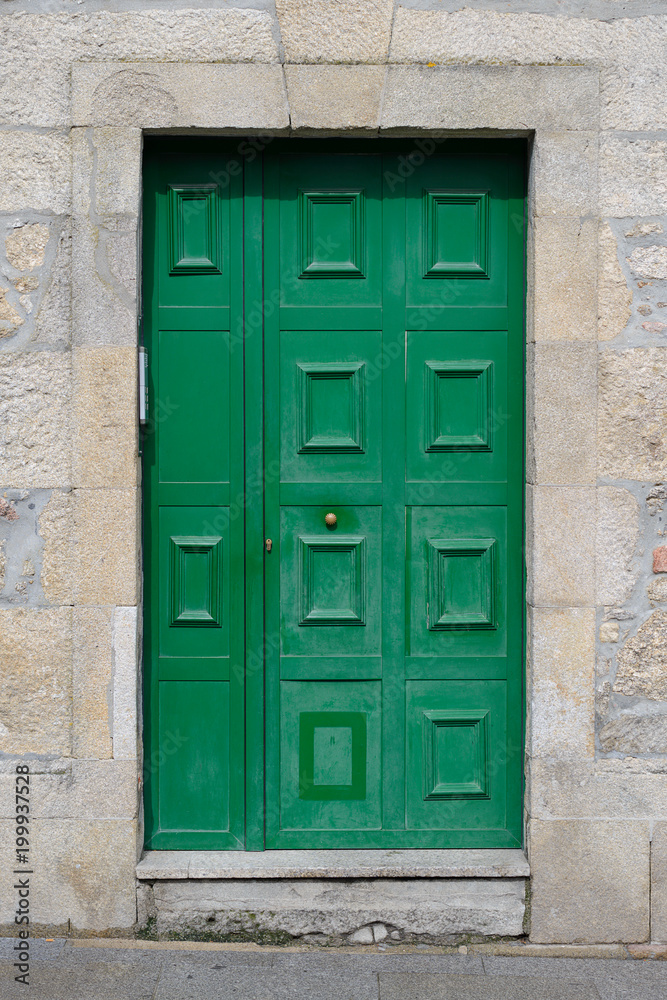 old green door in a stone wall