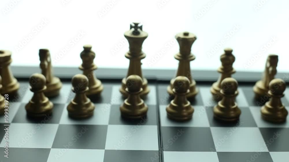 The gold and silver chess on board close up footage.