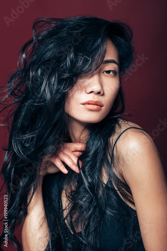Beautiful asian woman portrait on brown background