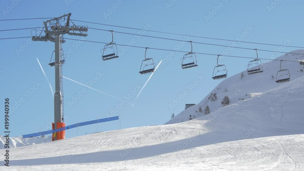 Chairlifts running and airplanes flying Chairlifts running and airplanes flying