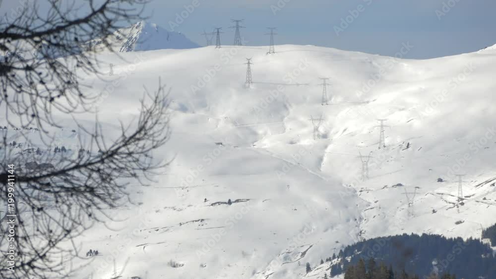 Poles on a snowy hill Poles on a snowy hill