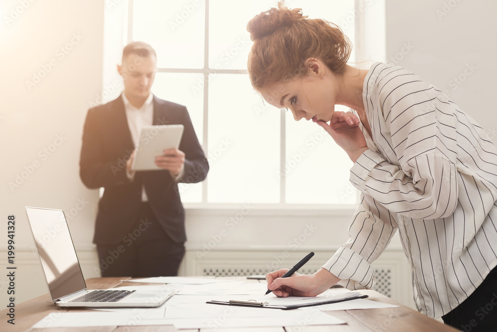 custom made wallpaper toronto digitalMale and female managers working on financial papers at modern office interior