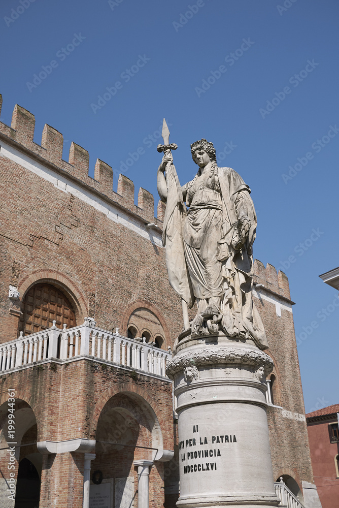 Treviso, Italy - March 26, 2018: View of Palazzo dei Trecento and the Teresona statue