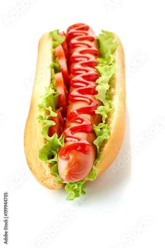 Hot dog with lettuce and tomato on white