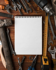 Labor day background - many handy tools, on wooden background top view with copy space for text.