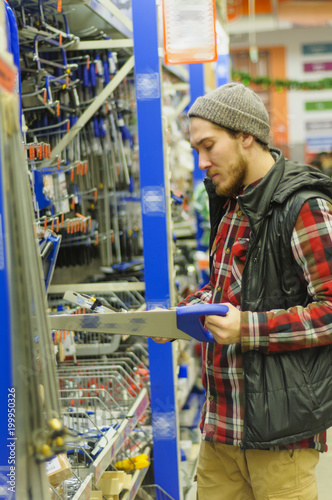 Man in a hardware store © Сергей Лабутин