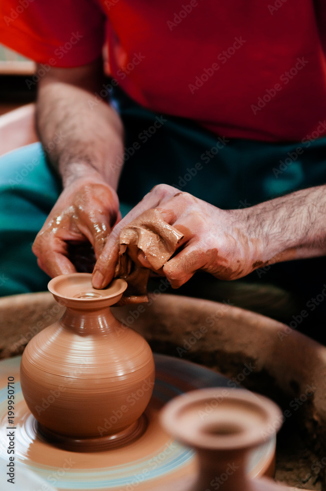 Man making pottery art, clay work close up hands shot shot Stock