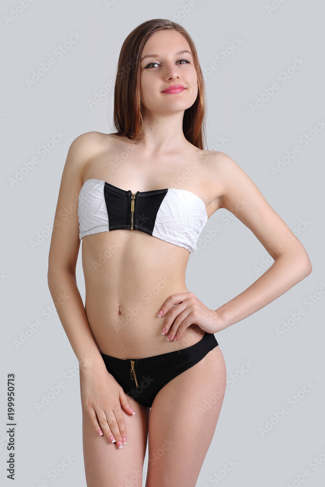 Fototapeta premium young cute girl posing in bikini
